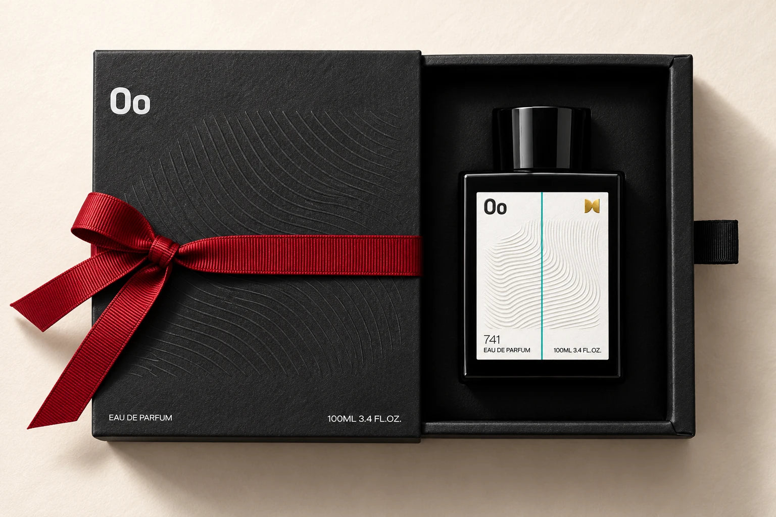 Oo La Lab black embossed 100ml gift box, partially open with a crimson ribbon and fragrance inside